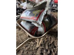 8 bags of non slip stone- wheelbarrow