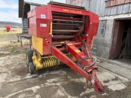 N.H. 848 round baler 48inX54in bale 