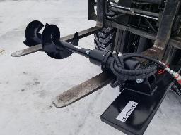 Tari&egrave;re attache skid steer