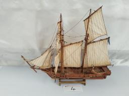 A crafted model of a traditional wooden sailing ship
